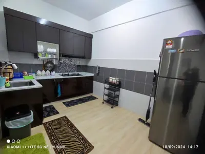 a kitchen with a stainless steel refrigerator in a room at 3 Bedroom Apartment YuCasa Sg Nibong Penang in Bayan Lepas
