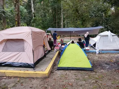 a group of tents and a group of people camping at Camp Site in Tapah