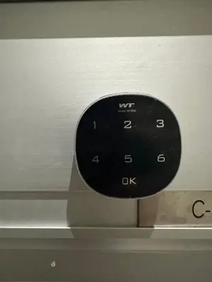 a black remote control sitting on top of a microwave at ICC Premier Suites Ipoh City Centre by Landmark in Ipoh