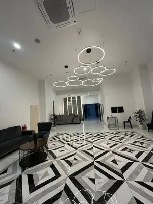 a living room with a black and white tile floor at ICC Premier Suites Ipoh City Centre by Landmark in Ipoh