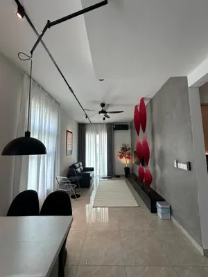 a living room with a couch and a table at ICC Premier Suites Ipoh City Centre by Landmark in Ipoh
