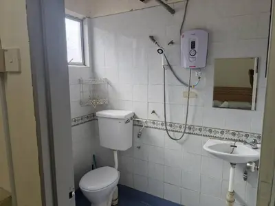 a bathroom with a shower and a toilet and a sink at Cool memories smart stay in Tanah Rata
