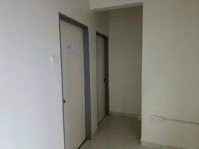 an empty room with two doors in a building at Cool memories smart stay in Tanah Rata