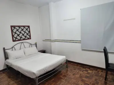 a small bedroom with a bed in a room at Cool memories smart stay in Tanah Rata