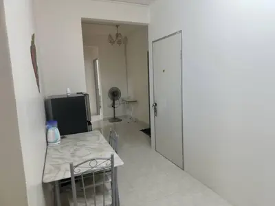 a room with a table and a room with a door at Cool memories smart stay in Tanah Rata