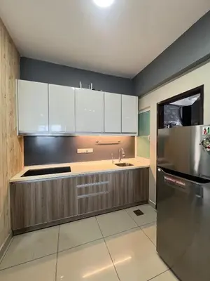a kitchen with white cabinets and a stainless steel refrigerator at The Majestic Ipoh 3R2B SLY Home Twin City view unit in Ipoh