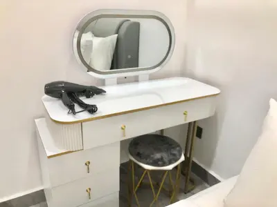 a bathroom with a mirror and a hair dryer on a sink at BigLanded House NR Penang Hill & Kek Lok Si Temple in Ayer Itam