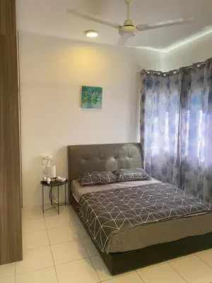 a bedroom with a bed in a room at Qaseh Homestay Cameron Highlands The Quintet Apartment Tanah Rata in Tanah Rata