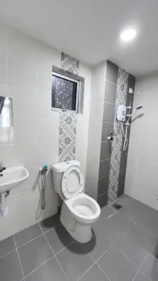 a bathroom with a toilet and a sink at ANAS Homestay in Ipoh