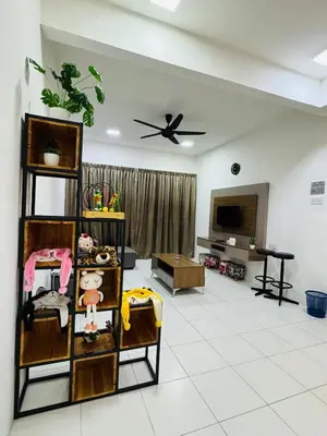 a living room filled with furniture and a flat screen tv at AYAAN QUINTET FAMILY HoMESTAY Free Parking in Tanah Rata