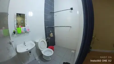 a bathroom with a toilet and a sink at Ss homestay in Seri Manjung