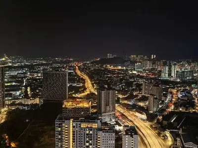 a view of a city at night at LS Iconic Regency #Queensbay Mall#FIZ#Airport in Bayan Lepas
