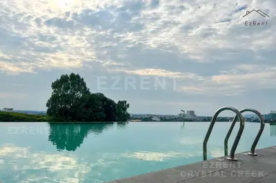 a swimming pool with a tree in the water at Taiping Peaceful Retreat near Lake Garden with WiFi in Taiping