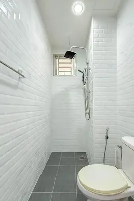 a white bathroom with a toilet and a shower at Taiping Peaceful Retreat near Lake Garden with WiFi in Taiping