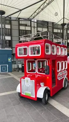 a red bus is parked in a building at Astana D'Cameron Homestay in Brinchang