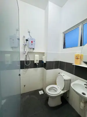 a bathroom with a toilet and a sink at AYAAN HOMESTAY HILL VIEW INN 2 FREE Wifi and Netflix in Cameron Highlands