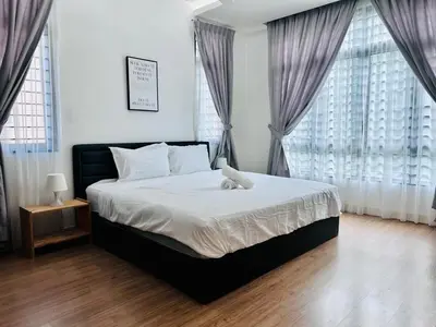 a bedroom with a bed with a teddy bear on it at New Sea Breeze Landed Home 13pax BatuFerrigghi in Batu Ferringhi