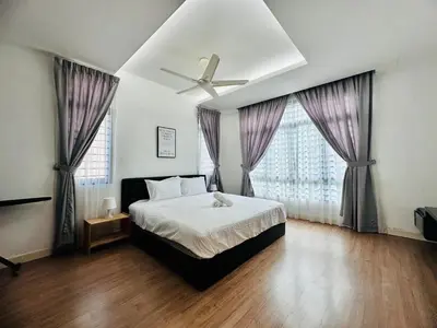 a bedroom with a bed and a ceiling fan at New Sea Breeze Landed Home 13pax BatuFerrigghi in Batu Ferringhi
