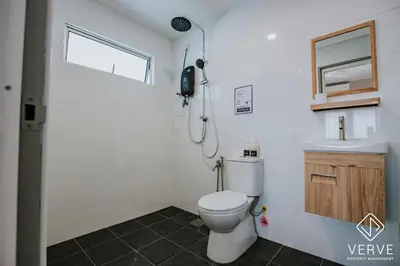 a bathroom with a toilet and a sink at The Time Capsule 4B3B BY Verve 12 Pax in Ipoh