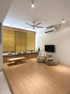 a living room with a table and a tv at The Time Capsule 4B3B BY Verve 12 Pax in Ipoh