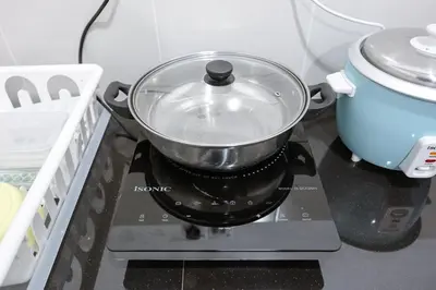 a pot sitting on top of a stove at Modern Studio Retreat -Prime Location Brinchang Clover Home 1-03 in Brinchang