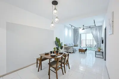 a dining room and living room with a table and chairs at Modern Studio Retreat -Prime Location Brinchang Clover Home 1-03 in Brinchang