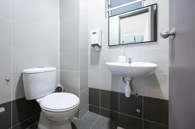 a bathroom with a toilet and a sink at Elegant Studio Escape at Emerald Avenue Brinchang Cameron Highland Clover Home 4-03 in Brinchang