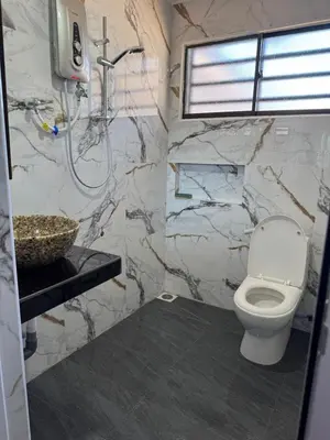 a bathroom with a toilet and a sink at Canning Garden-The Ipohscape in Ipoh