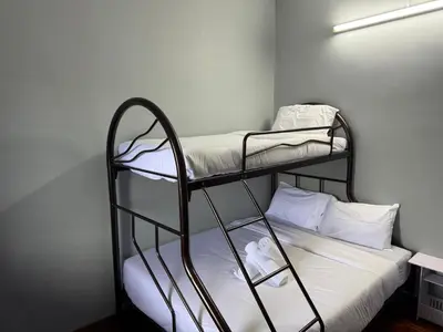 a couple of bunk beds in a room at Canning Garden-The Ipohscape in Ipoh