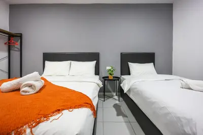 two beds sitting next to each other in a room at Family Retreat Cozy Stay in Brinchang Cameron Highlands Clover Home M-08 in Brinchang