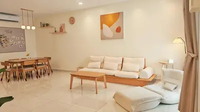 a living room with a couch and a table at No 8 Homestay in Pangkor