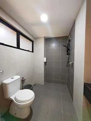 a bathroom with a toilet and a shower at No 8 Homestay in Pangkor