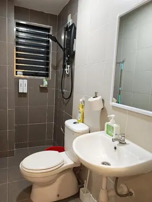 a bathroom with a toilet and a sink at No 8 Homestay in Pangkor
