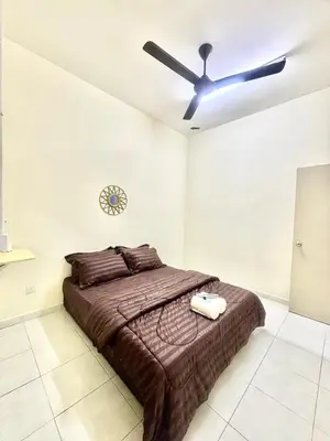 a bedroom with a bed and a ceiling fan at H&Z Guesthouse Kulim Hi-Tech - Free Wifi - Netflix in Kulim
