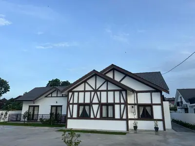 a house with a black and white at The Ranch in Ipoh