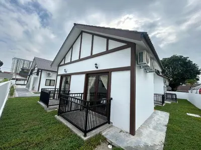 a small white house with a black gate at The Ranch in Ipoh