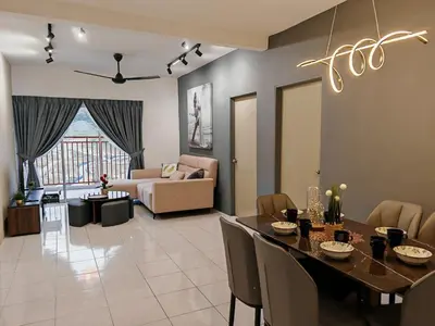 a dining room and living room with a table and chairs at ModernStyleW930WarmStay at Emerald Avenue Brinchang 3Room3Bath 2Parking in Brinchang