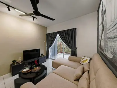 a living room with a couch and a tv at ModernStyleW930WarmStay at Emerald Avenue Brinchang 3Room3Bath 2Parking in Brinchang