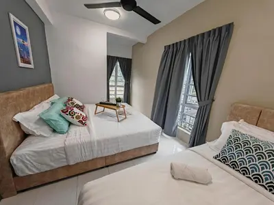 two beds in a room with two windows at ModernStyleW930WarmStay at Emerald Avenue Brinchang 3Room3Bath 2Parking in Brinchang