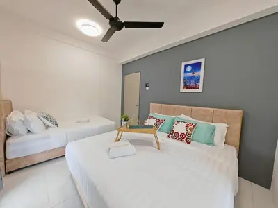 a bedroom with two beds and a ceiling fan at ModernStyleW930WarmStay at Emerald Avenue Brinchang 3Room3Bath 2Parking in Brinchang
