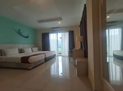 a bedroom with a large bed in a room at Okay Marina Lumut Homestay in Lumut