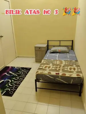 a bedroom with a bed with a sign on the wall at Zunnurain Homestay in Kampong Batu Lapan