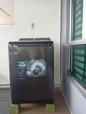 a trash can sitting next to a building at Home in Ipoh in Ipoh