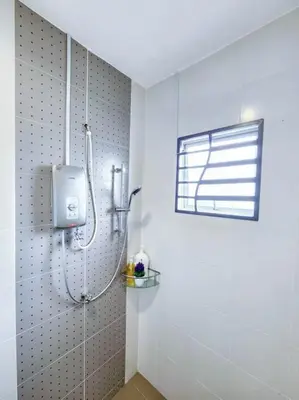 a shower in a bathroom with a window at Home in Ipoh in Ipoh