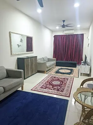 a living room with a couch and a table at Amirah homestay in Kampong Sungai Wangi Dalam