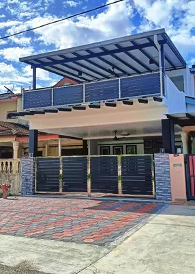 a house with a blue gate and a garage at SR Kampar 2-Storey LANDED HOMESTAY in Kampar