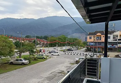 a view of a street with cars on the road at SR Kampar 2-Storey LANDED HOMESTAY in Kampar