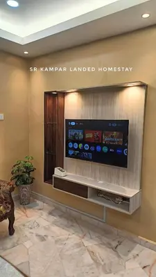 a flat screen tv on a wall in a lobby at SR Kampar 2-Storey LANDED HOMESTAY in Kampar