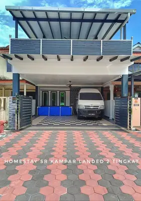 a car parked under a garage with a van under it at SR Kampar 2-Storey LANDED HOMESTAY in Kampar