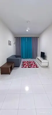 a large living room with a couch and a table at Aflah Home in Tapah Road